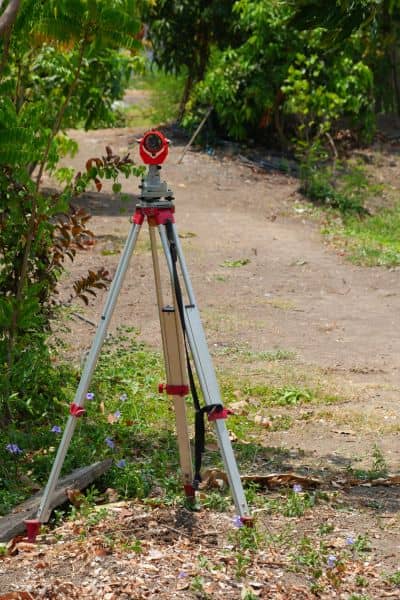 Survey equipment outdoors - ALTA SURVEY Texas Surveying equipment set up outdoors for a property line survey, showing how boundaries are measured