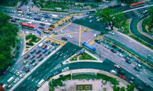 Arlington traffic intersection transportation engineers - ALTA SURVEY Texas Aerial view of a busy Arlington intersection with multiple lanes and vehicles showing transportation engineers’ role in improving road safety