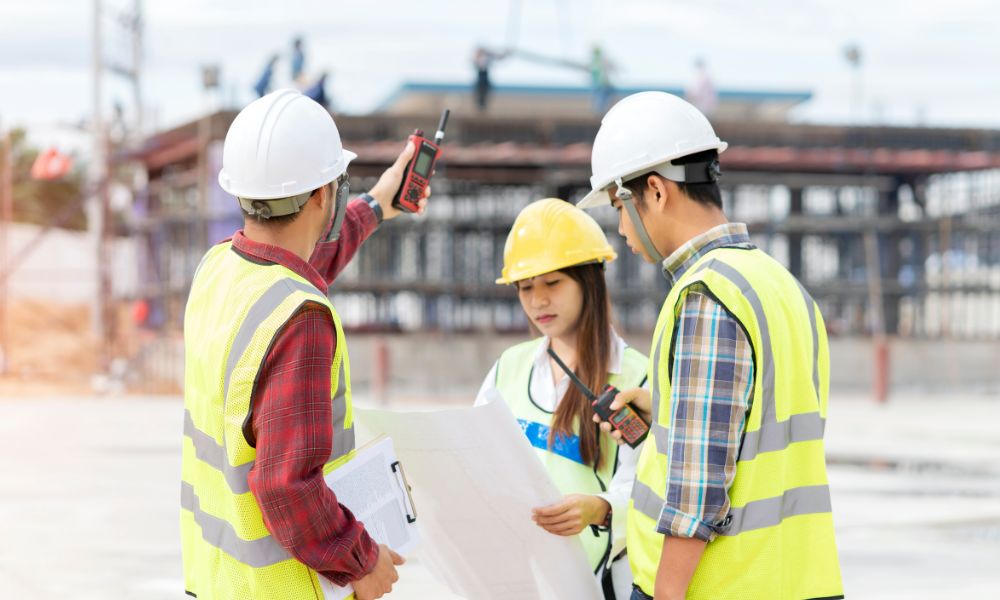 Engineer witness reviewing construction plans on site in McKinney 