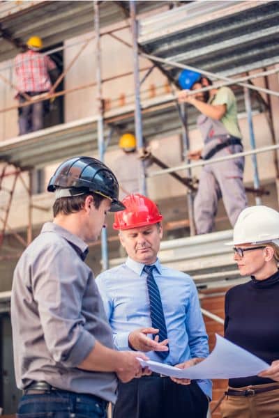 Project management cost control denton - ALTA SURVEY Texas Project management team in Denton reviewing plans on-site to ensure cost control and construction progress