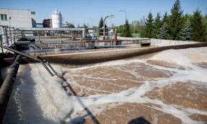 Water treatment plant expansion showing active flow, highlighting infrastructure upgrades that impact flood study and drainage requirements