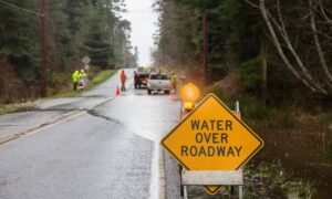 Water over roadway - ALTA SURVEY Texas Flooded roadway with warning sign and construction crew illustrating the importance of proper detention pond design and stormwater drainage