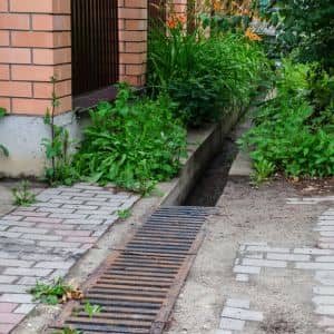 Public walkway linear drainage - ALTA SURVEY Texas Linear drainage system along a public walkway where stormwater design helps prevent flooding
