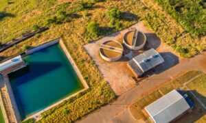 Environmental engineer reviewing water treatment systems that support growing urban communities