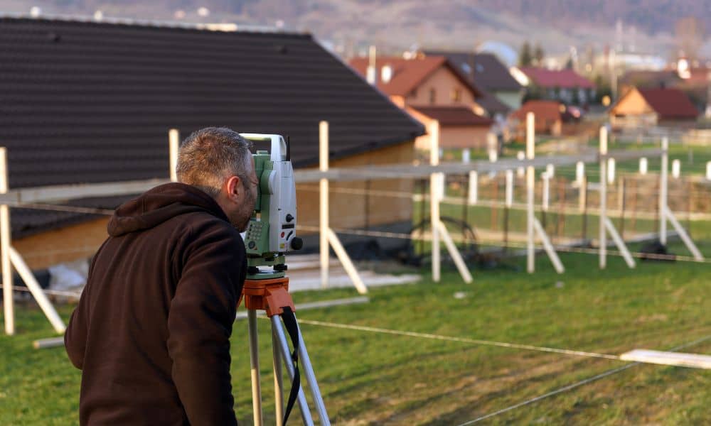 Home property survey - ALTA SURVEY Texas A surveyor measuring a home’s property to help with a FEMA elevation certificate and flood safety