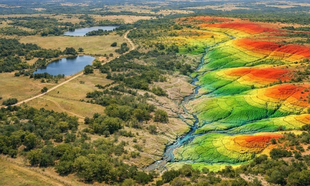 Aerial view of a large ranch with LiDAR mapping showing terrain elevations, drainage patterns, and water features across the property