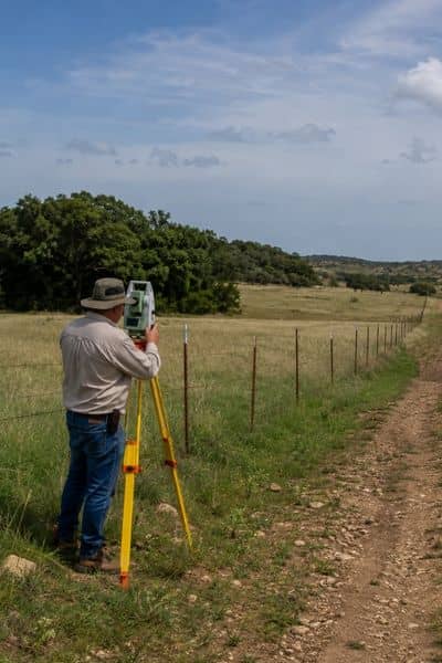 Average cost for a land survey texas - ALTA SURVEY Texas Land surveyor working on a rural Texas property, with terrain and access influencing the average cost for a land survey