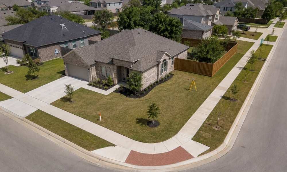 Texas residential corner lot survey - ALTA SURVEY Texas Drone view of a residential corner lot in Texas showing two street frontages and the surrounding subdivision