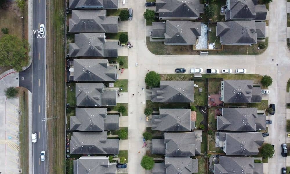 Aerial view of a neighborhood with homes and properties relevant to a loan closing survey